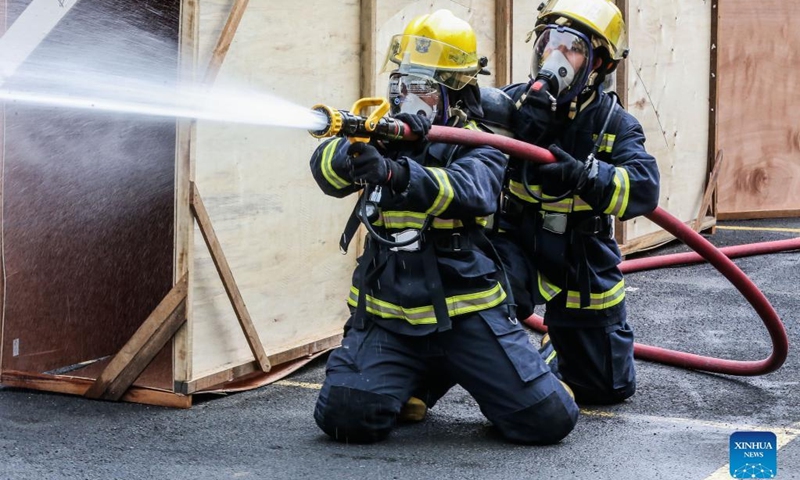 Female firefighters participate in the Women Firefighters Skills Olympics at the Philippine Bureau of Fire Protection-National Capital Region (BFP-NCR) headquarters in Quezon City, the Philippines on March 14, 2022.(Photo: Xinhua)